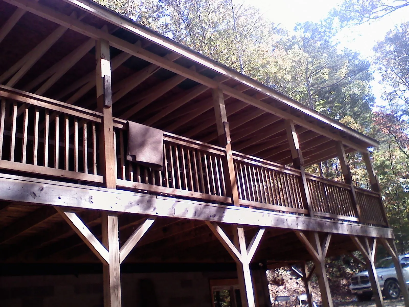 Timber framing under a new elevated porch and deck — Roof Leak Repair in Nye by Roofing Brothers